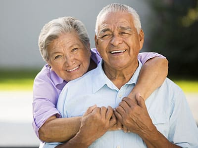 Photograph of a smiling elderly couple